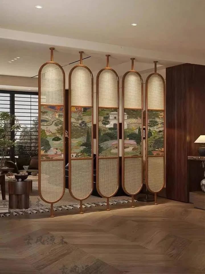 Asian-inspired room divider with rattan and landscape art panels.