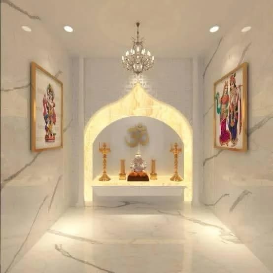 Ornate Indian Pooja room with marble, a statue, and religious paintings.
