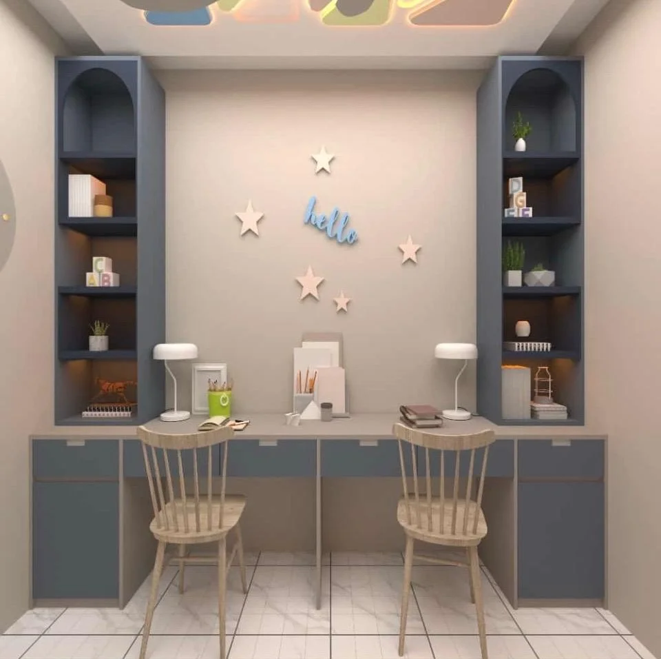Shared kids study space with blue shelving, light wood chairs, and star decor.