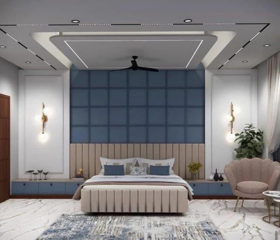 Modern bedroom with blue wall, beige bed, marble floor, and pink accent chair.