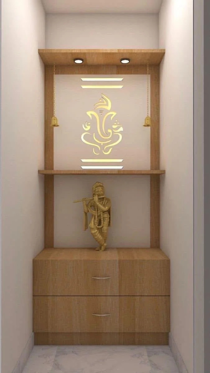 Modern wooden pooja shelf with Ganesha, Krishna, and bells. Simple, compact spiritual space.