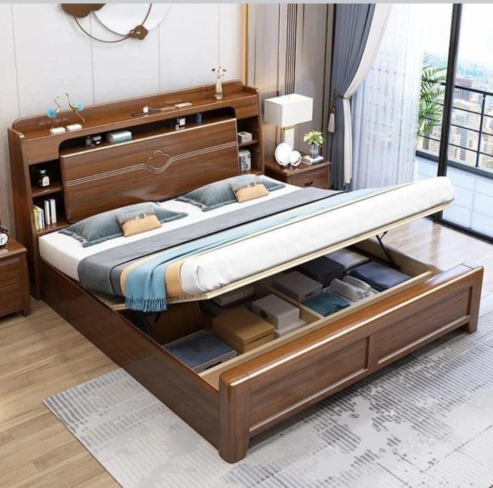 Dark wood bed frame with lift-up storage, headboard shelving, and attached nightstands.
